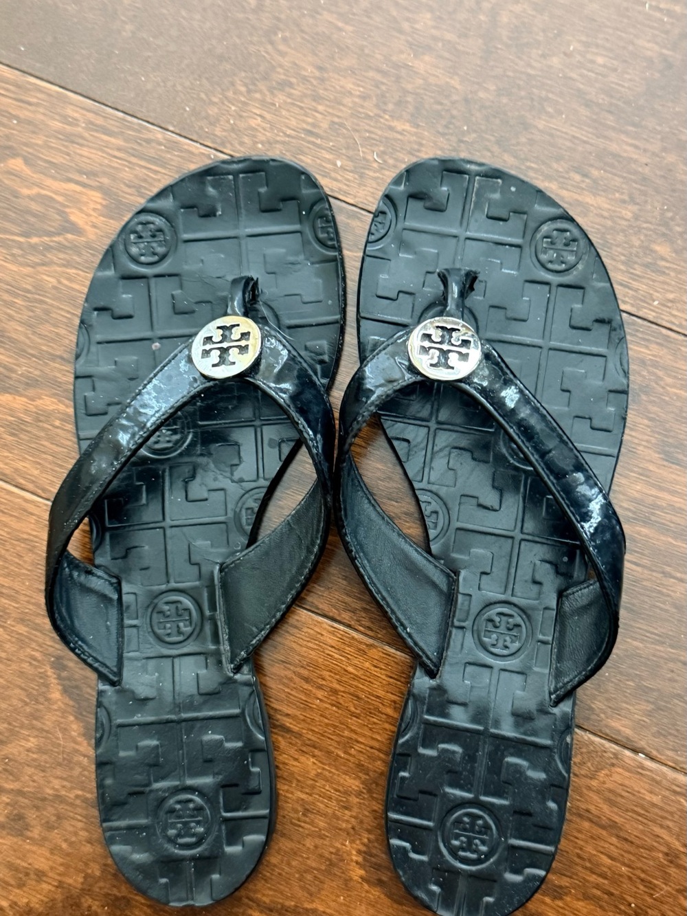 Tory Burch Black Logo Medallion Thong Sandals. Always classic.